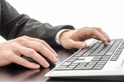 Businessman typing on keyboard