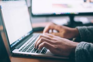 A writer prepares to type up a press release for a tech firm.