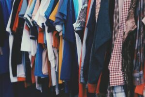 Clothes are hung up in a store.