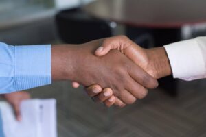 Two men handshake on a deal.